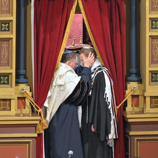 Me standing with Rabbi Aaron Panken z"l, with his hands on my head, in the ark at Plum Street Temple in Cincinnati at the moment of ordination.